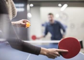 ping pong playing-table-tennis-in-office