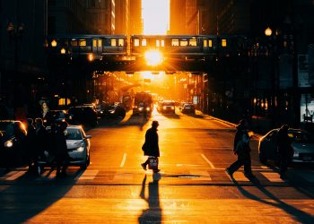 people-crossing-chicago-street-sunset
