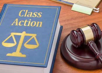 A law book with a gavel - Class action