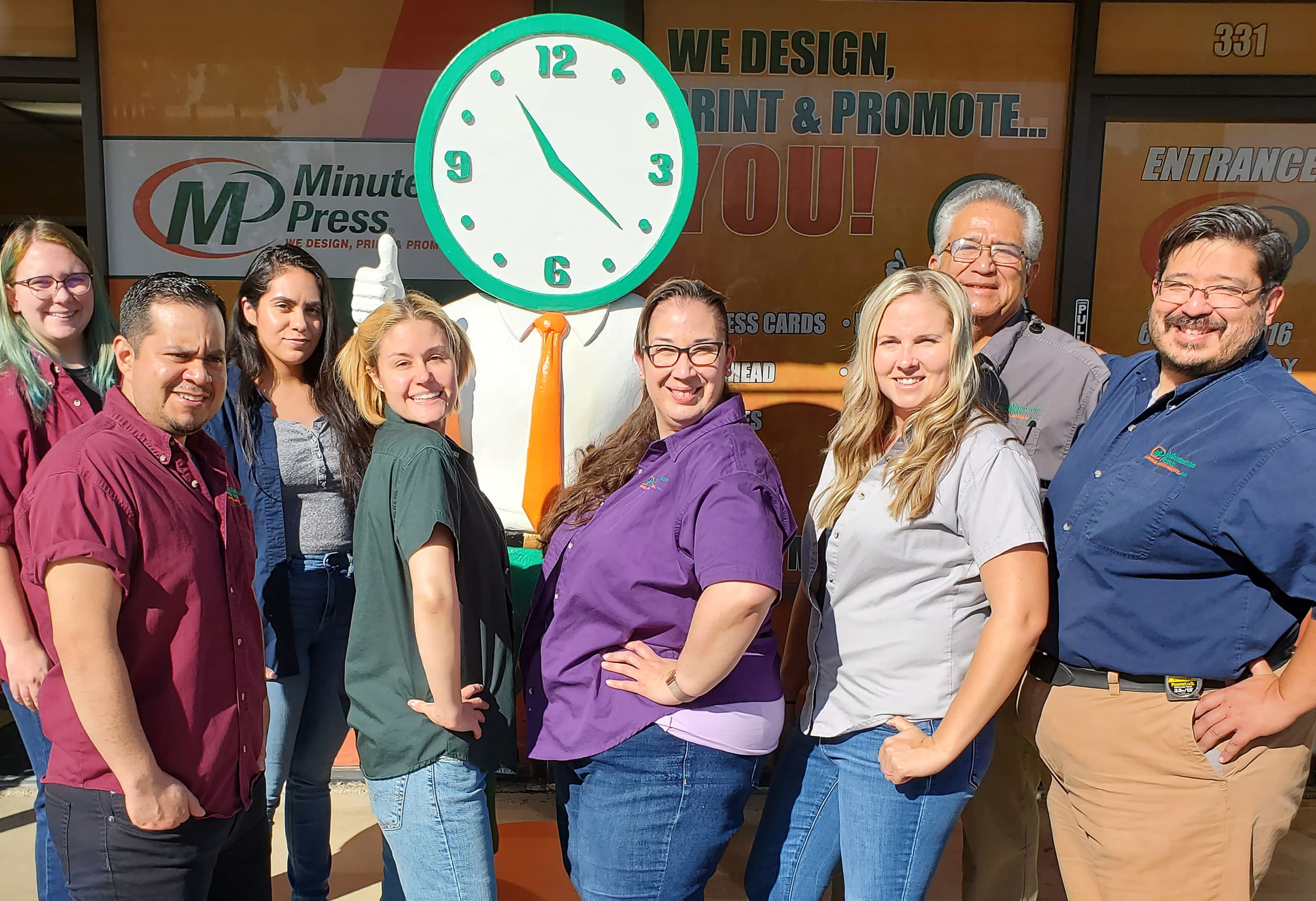 Minuteman Press Franchise Owner Peter Castorena and Team with Giant Minute Man