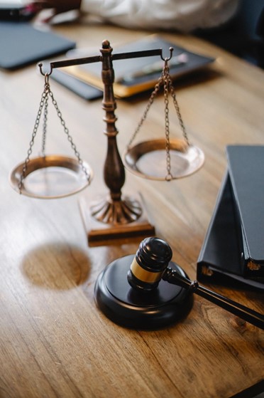https://www.pexels.com/photo/judges-desk-with-gavel-and-scales-5669619/