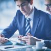 stock photo businessmen discussing document