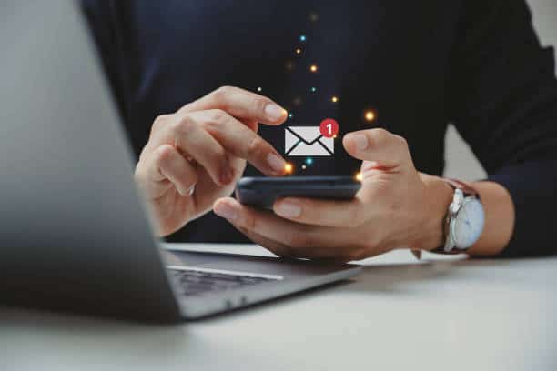 Hand of businessman using smartphone for email with notification alert, Online communication concept.