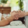 Shot of an attractive young woman getting massaged at a beauty spa