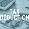 Tax deductions. Office table with financial report.