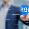 Businessman using ROI Return on Investment indicator for improving business performance